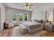 Main bedroom with hardwood floors, large windows and a sitting area at 8874 E Flathorn Dr, Scottsdale, AZ 85255