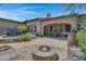 Outdoor entertaining area with hot tub, fire pit, and seating at 8874 E Flathorn Dr, Scottsdale, AZ 85255