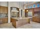 Gourmet kitchen with large island and stainless steel appliances at 8874 E Flathorn Dr, Scottsdale, AZ 85255
