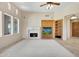 Spacious living room with a fireplace and lots of natural light at 8874 E Flathorn Dr, Scottsdale, AZ 85255