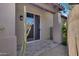 Stone patio adjacent to the house with sliding glass door access at 8874 E Flathorn Dr, Scottsdale, AZ 85255