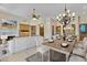 Bright dining area with chandelier and large windows at 8874 E Flathorn Dr, Scottsdale, AZ 85255