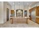 Island kitchen with granite countertops and custom cabinetry at 8874 E Flathorn Dr, Scottsdale, AZ 85255