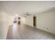 Living room with tile floors and kitchen view at 10828 N Biltmore Dr # 203, Phoenix, AZ 85029