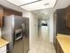 Kitchen with stainless steel refrigerator and wood cabinets at 10828 N Biltmore Dr # 203, Phoenix, AZ 85029