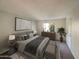 Main bedroom with a king-size bed and modern decor at 10828 N Biltmore Dr # 203, Phoenix, AZ 85029