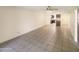 Bright living room with tile floors and ceiling fan at 10828 N Biltmore Dr # 203, Phoenix, AZ 85029