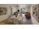 Combined dining and living room with a brown sofa at 10828 N Biltmore Dr # 203, Phoenix, AZ 85029