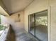 Private balcony with sliding glass doors and view of trees at 10828 N Biltmore Dr # 203, Phoenix, AZ 85029