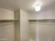 Well-lit closet with double hanging rods and shelving at 10828 N Biltmore Dr # 203, Phoenix, AZ 85029