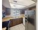 Kitchen with stainless steel appliances and wood cabinets at 10828 N Biltmore Dr # 203, Phoenix, AZ 85029
