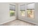 Bright office space with large windows and blinds at 15631 W Bethesda Ct, Surprise, AZ 85374