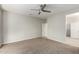 Comfortable bedroom with ceiling fan and walk-in closet at 15631 W Bethesda Ct, Surprise, AZ 85374