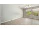 Bright bedroom with ceiling fan and tile floor at 15631 W Bethesda Ct, Surprise, AZ 85374