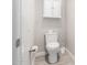 Clean and simple bathroom with a toilet and wall-mounted cabinet at 15631 W Bethesda Ct, Surprise, AZ 85374