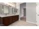 Spacious bathroom with double vanity and large mirror at 15631 W Bethesda Ct, Surprise, AZ 85374