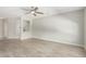 Living room with tile floor, neutral walls and ceiling fan at 15631 W Bethesda Ct, Surprise, AZ 85374