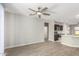 Open living room with kitchen views and tile floors at 15631 W Bethesda Ct, Surprise, AZ 85374