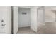 Coat closet with shelving and hooks near entry at 15631 W Bethesda Ct, Surprise, AZ 85374