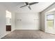Bedroom with large window, ceiling fan and ensuite access at 15631 W Bethesda Ct, Surprise, AZ 85374