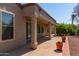 Covered patio with brick flooring and desert landscaping at 15631 W Bethesda Ct, Surprise, AZ 85374