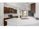 Spacious kitchen featuring dark wood cabinets and a large island at 15631 W Bethesda Ct, Surprise, AZ 85374