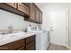 Laundry room with sink and cabinets at 15631 W Bethesda Ct, Surprise, AZ 85374