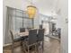 Bright dining room features a rustic wood table and modern light fixture at 11333 N 92Nd St # 2049, Scottsdale, AZ 85260