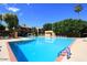 Community pool with surrounding lounge chairs at 3031 N Civic Center Plz # 230, Scottsdale, AZ 85251
