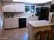 Well-equipped kitchen with white cabinets and island at 3031 N Civic Center Plz # 230, Scottsdale, AZ 85251