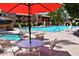 Community pool and spa with lounge chairs and umbrellas at 3031 N Civic Center Plz # 230, Scottsdale, AZ 85251