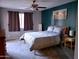 Spacious bedroom with a ceiling fan and accent wall at 3031 N Civic Center Plz # 230, Scottsdale, AZ 85251