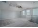 Bright and airy loft with carpeted floors and a ceiling fan at 16062 W Alameda Rd, Surprise, AZ 85387