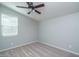 Simple bedroom with ceiling fan and neutral wall colors at 16062 W Alameda Rd, Surprise, AZ 85387