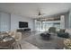 Bright and airy living room with sliding glass doors opening to patio at 16062 W Alameda Rd, Surprise, AZ 85387