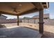 Covered patio with ceiling fan overlooks a large backyard at 16062 W Alameda Rd, Surprise, AZ 85387
