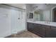 Modern bathroom with double vanity, large shower, and tile floors at 16062 W Alameda Rd, Surprise, AZ 85387