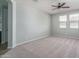 Bright bedroom featuring carpeted floors and a ceiling fan at 16062 W Alameda Rd, Surprise, AZ 85387