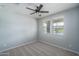 Bright office space with ceiling fan and two windows at 16062 W Alameda Rd, Surprise, AZ 85387