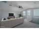 Spacious loft area with vaulted ceilings, carpeted floor, and ceiling fan at 16062 W Alameda Rd, Surprise, AZ 85387