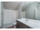 Clean bathroom with a shower/tub combo, vanity, and mirror at 16062 W Alameda Rd, Surprise, AZ 85387
