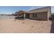 Back exterior of house with covered patio and landscaping at 16062 W Alameda Rd, Surprise, AZ 85387