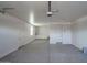Spacious garage with interior access door and neutral walls at 16062 W Alameda Rd, Surprise, AZ 85387