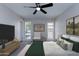 Main bedroom with ceiling fan and large windows at 10608 W Edgewood Dr, Sun City, AZ 85351