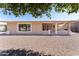 Ranch style home with covered patio and gravel landscaping at 10608 W Edgewood Dr, Sun City, AZ 85351