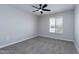 Simple bedroom with ceiling fan and neutral walls at 10608 W Edgewood Dr, Sun City, AZ 85351