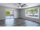 Living room with large window and sliding glass doors at 10608 W Edgewood Dr, Sun City, AZ 85351