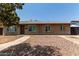 Brick ranch home with a paved driveway at 8406 W Roma Ave, Phoenix, AZ 85037