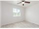 Well lit bedroom with ceiling fan and window blinds at 8406 W Roma Ave, Phoenix, AZ 85037