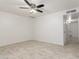 Bright living room with tile floors and ceiling fan at 8406 W Roma Ave, Phoenix, AZ 85037